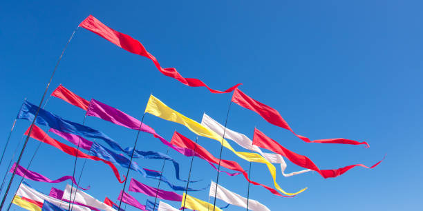 istock Multicolored kites in the blue sunny sky 1156751936