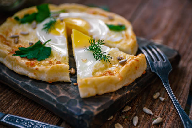istock Khachapuri from rice flour, cottage cheese dough with egg and mozzarella cheese. 1156751978