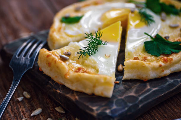 istock Khachapuri from rice flour, cottage cheese dough with egg and mozzarella cheese. 1156752007