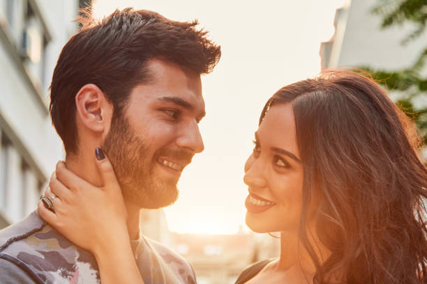 istock Cute young couple outdoors on the street. 1156755427