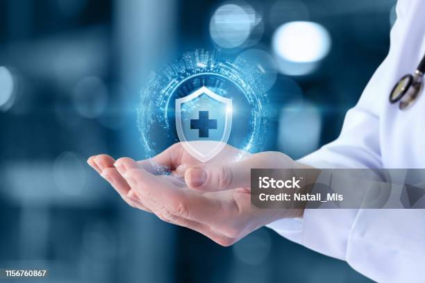 The Doctor Shows The Icon Of The Protection Of Health Stock Photo - Download Image Now