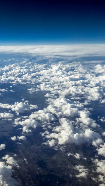 istock Panorama above white clouds as seen through window of an aircraft. 1156764356