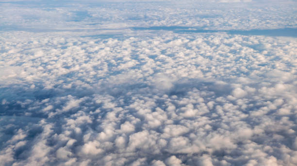 istock Panorama above white clouds as seen through window of an aircraft. 1156764583