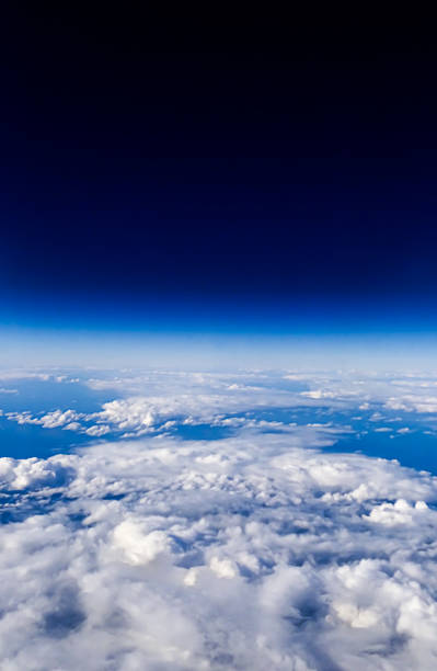 istock Panorama above white clouds as seen through window of an aircraft. 1156764813