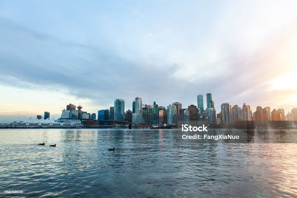 View of Vancouver financial district from Stanley Park seawall at sunset Vancouver - Canada Stock Photo