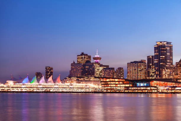 Panoramic view of Canada Place in downtown Vancouver at night Panoramic view of Canada Place in downtown Vancouver at night. Vancouver Trade and Convention Center. vancouver at night stock pictures, royalty-free photos & images
