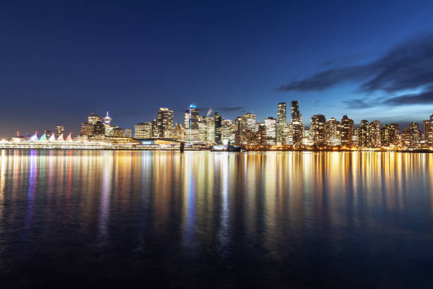 istock Glowing downtown Vancouver urban skyline at night 1156769823