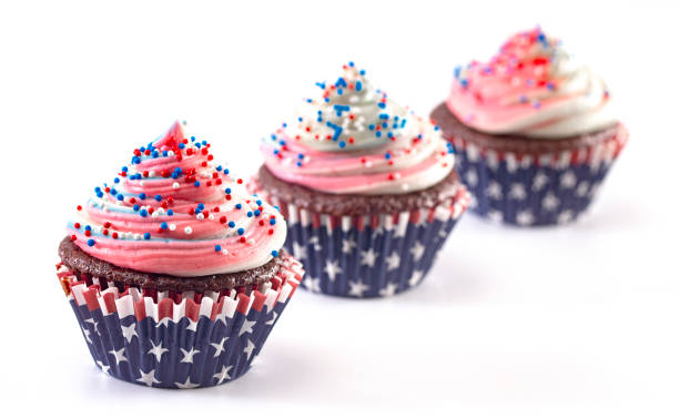 istock American Themed Cupcakes with Sprinkles on a White Background 1156769993