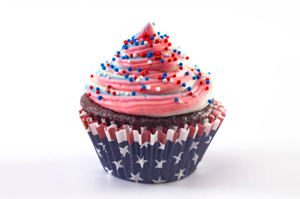 istock American Themed Cupcakes with Sprinkles on a White Background 1156769994