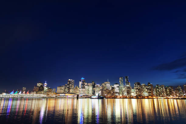 istock Glowing in dark downtown Vancouver cityscape panoramic view at night 1156770080