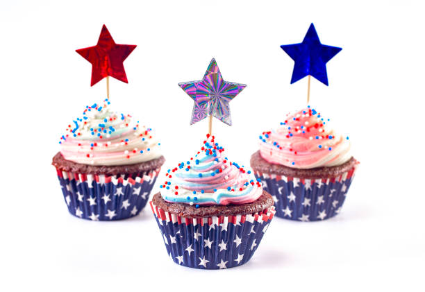 istock American Themed Cupcakes with Sprinkles and Decorations Isolated on a White Background 1156770158