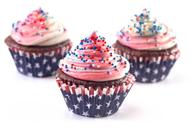 istock American Themed Cupcakes with Sprinkles on a White Background 1156770161