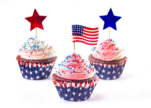 istock American Themed Cupcakes with Sprinkles and Decorations Isolated on a White Background 1156770430