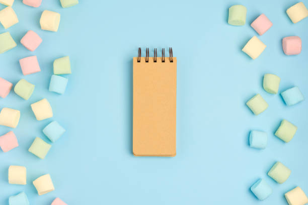 istock Pastel colour blue background with marshmallow. Cozy sweet background 1156771044