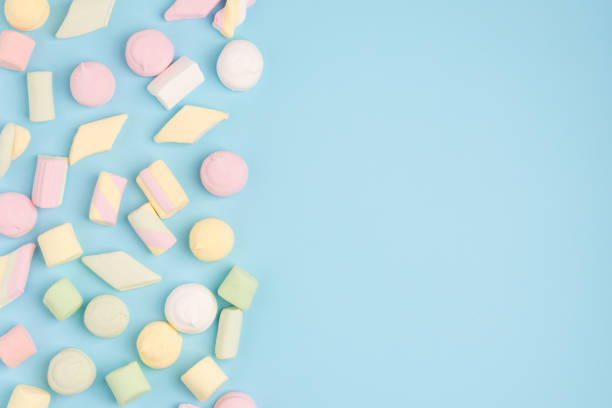 istock Marshmallows on pastel blue background. Cozy sweet background 1156771049