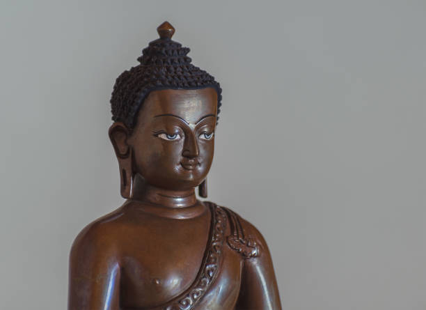 istock Closeup of Amitabha buddha statue on grey background 1156772544