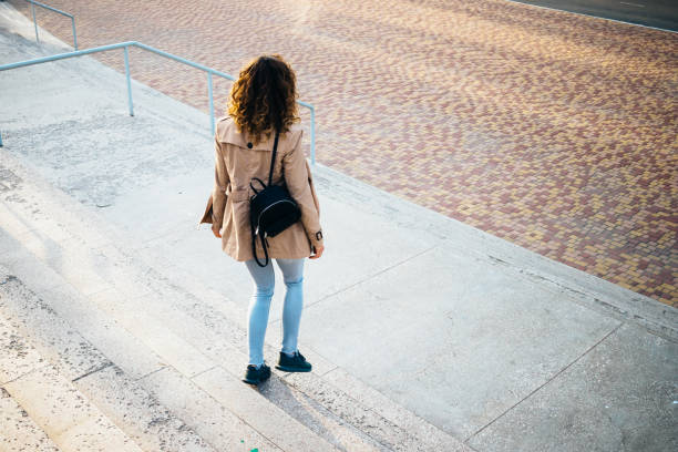 istock Stylish young woman dressed in beige coat 1156772549
