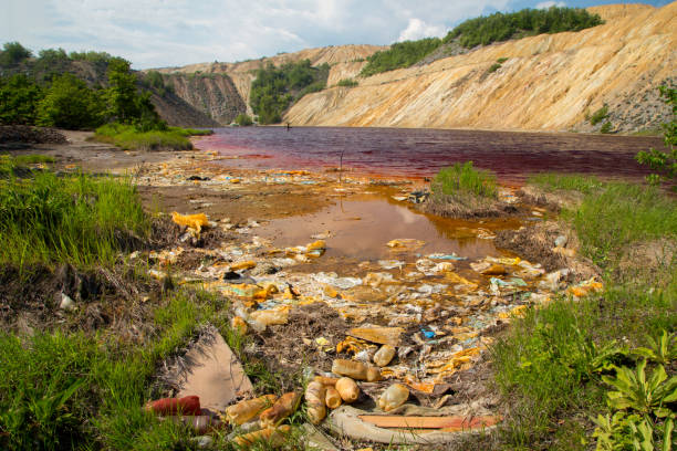 red artificial lake - tailings container environment pollution imagens e fotografias de stock