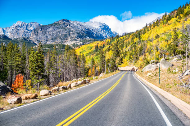 Road in Rocky Mountain National Park Colorado USA Stock photograph of a road in Rocky Mountain National Park Colorado USA on a sunny autumn day. estes park stock pictures, royalty-free photos & images