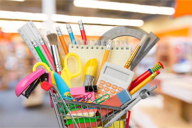 Education. Shopping cart with colorful school stationery, back to school background stationary stock pictures, royalty-free photos & images