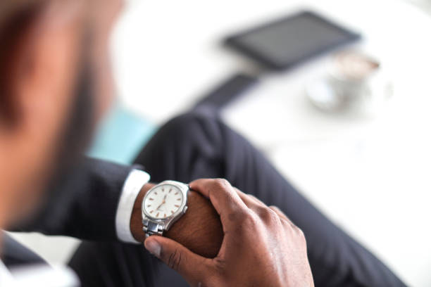 istock Business man checking the time 1156778307