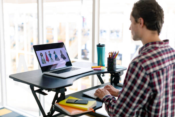 istock Male graphic designer working on laptop at desk 1156779929