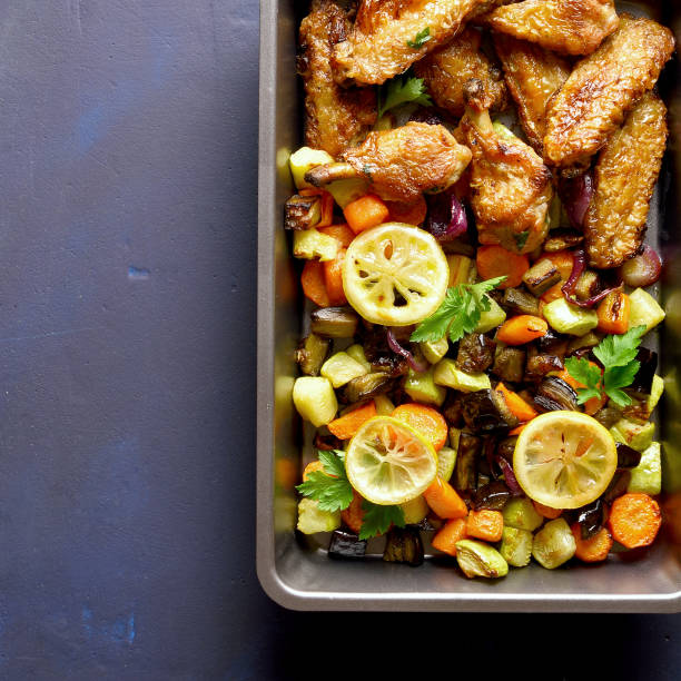 istock Grilled vegetables and chicken wings 1156780736
