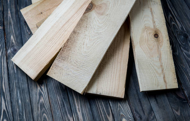 istock fresh pine boards on wooden background 1156781321