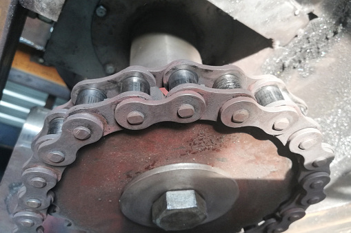 Chain drive. Driving roller chain on the drive sprocket in operation