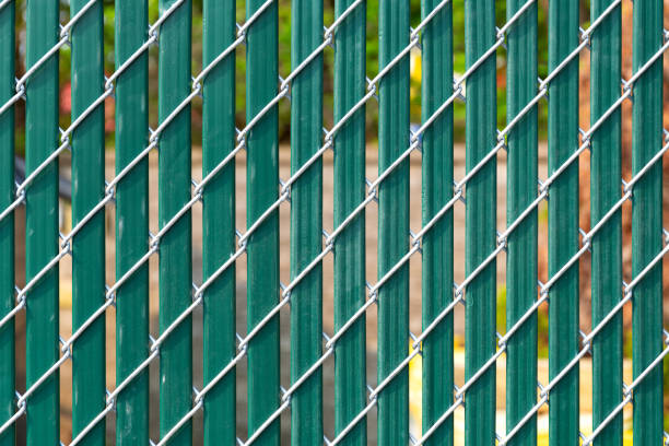 istock Chain link fence with privacy slats 1156785789