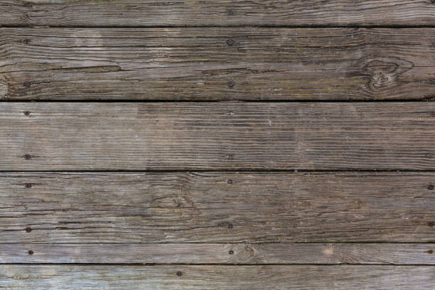 istock Rows of old weathered wood decking 1156785918