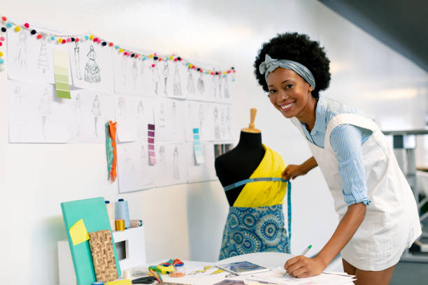 istock Female graphic designer writing on paper 1156786183