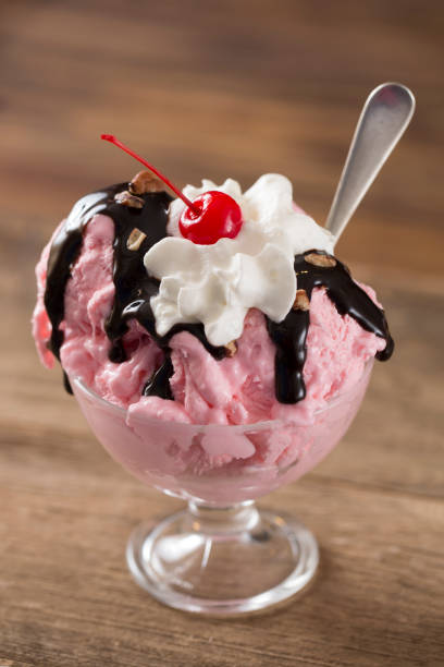 istock Strawberry Ice Cream Sundae on a Wood Background 1156787625