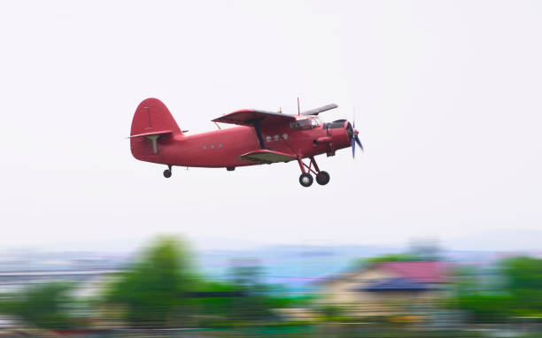 istock vintage red airplane flying 1156789825