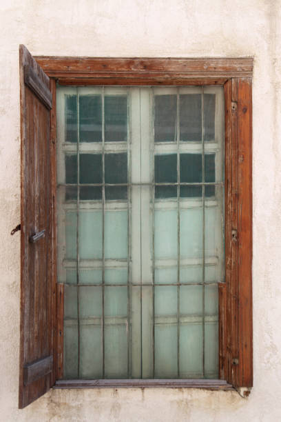 istock Old latticed window in wall, vertical picture 1156790239