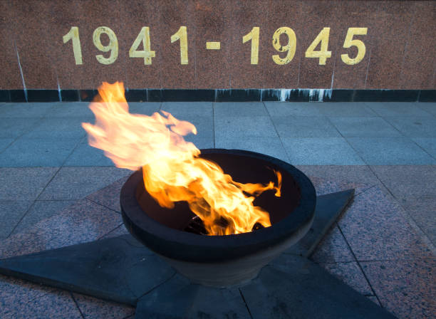 istock Burning eternal flame with dates of memory 1156791585
