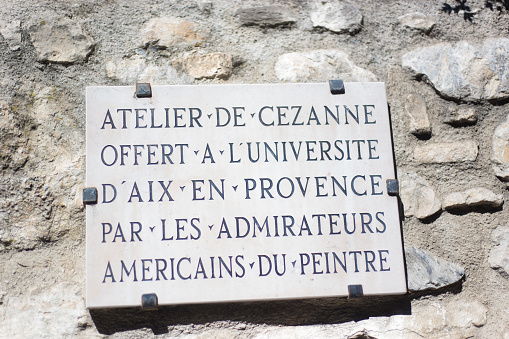 Aix-en-Provence, France - May 30, 2014: A pavement stud marks the walking path which takes visitors through places associated with  Paul Cézanne in Aix-en-Provence, France