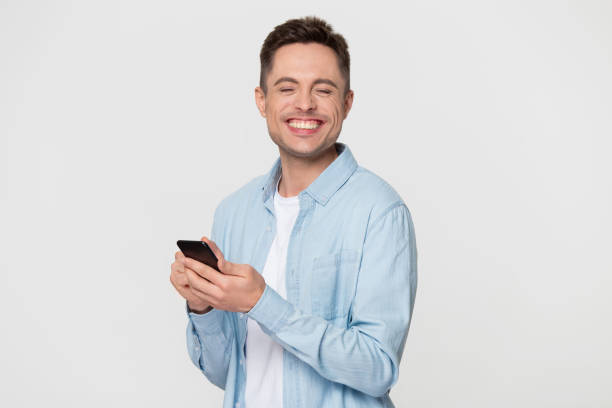 istock Excited Caucasian man on grey background happy get good message 1156795140