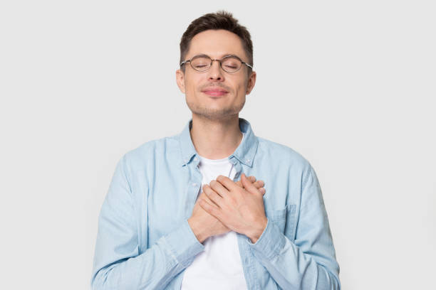 istock Grateful Caucasian man in glasses isolated on grey background 1156795148