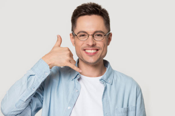istock Smiling Caucasian man in glasses show call me gesture 1156795155