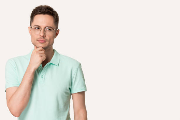 istock Thoughtful man in glasses touch chin making decision 1156795189