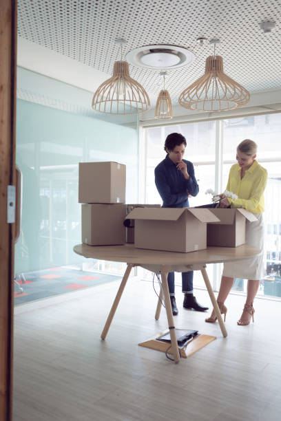 istock Male and female office executives interacting with each other 1156795427