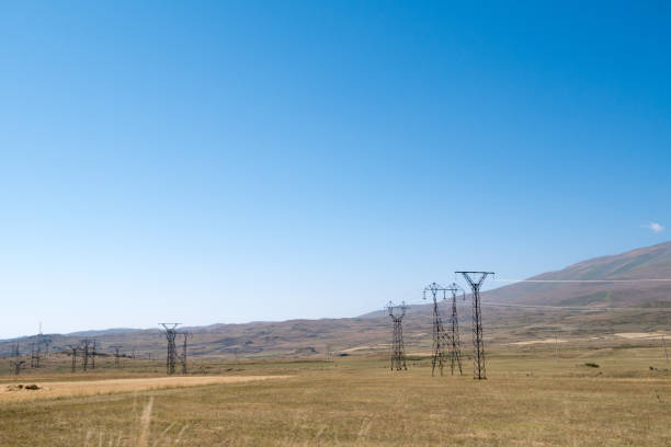 istock High Voltage power lines in a rural landscape 1156800597
