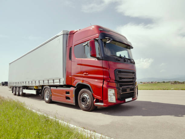 istock Red Truck on the Road 1156800602