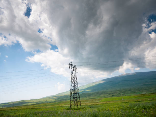 istock High Voltage power lines in a rural landscape 1156800604