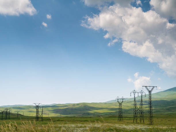 istock High Voltage power lines in a rural landscape 1156800605