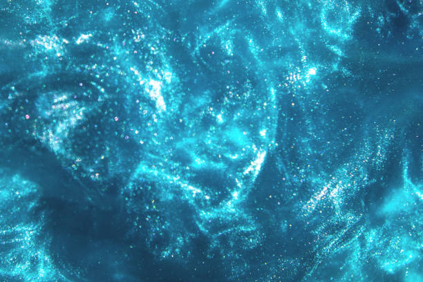istock Abstract blue glitter shimmering magic underwater space bokeh background 1156800936