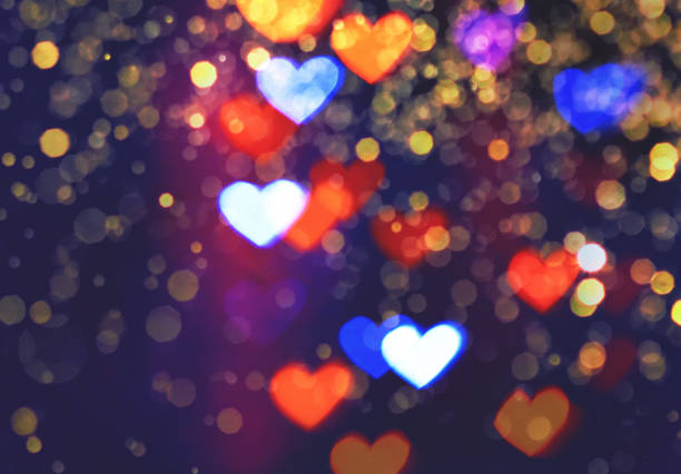 istock Colourful heart bokeh festive glitter background 1156801580