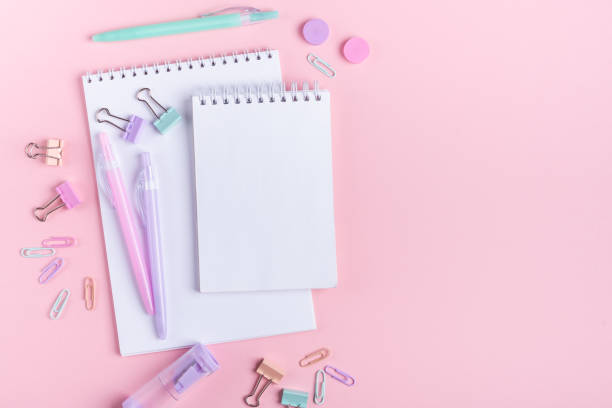 istock School background with notebooks and pastel colorful study accessories on pink background Back to school concept 1156803637