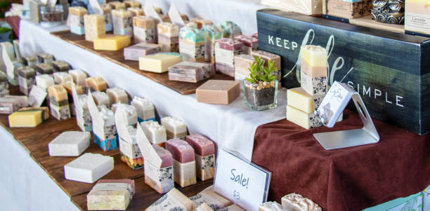 Colorful handmade soaps on display at a farmer's market. stock photo